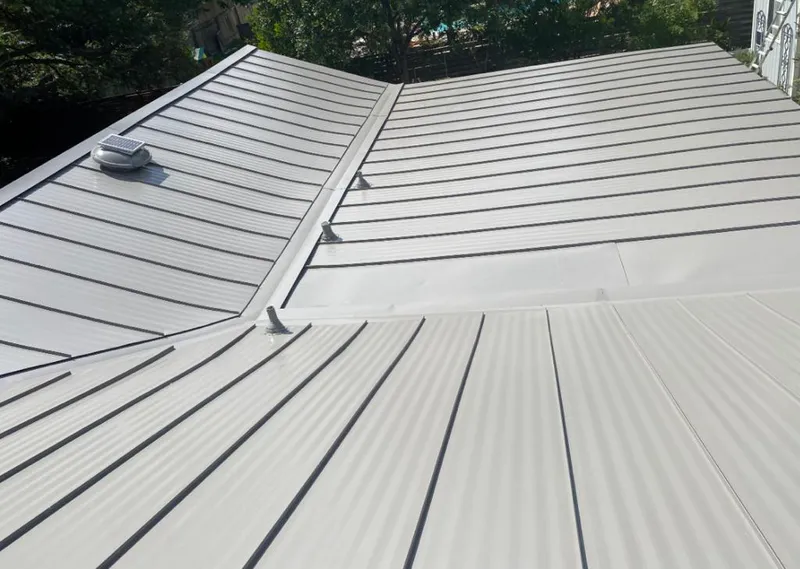 Solar attic fan installed on a metal roof for Roof Ventilation in Yosemite Lakes