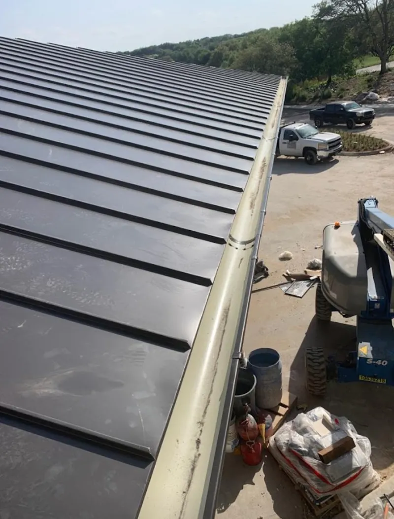 Standing seam panel and gutter detail on a metal roofing jobsite in Yosemite Lakes